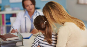 Mother and child with a female doctor